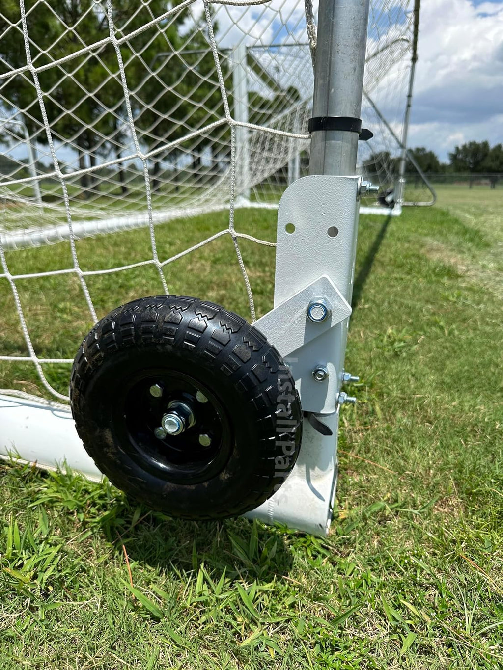 Soccer goal wheel kit installed on an Alumagoal goal